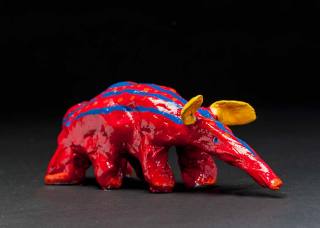 Ant Eater. with SIX legs! is a glazed ceramic sculpture in very vivid and unusual colours. Very unusual creation by Max Bullock after his stroke.