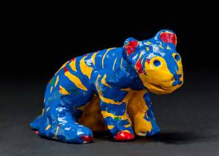 Tigger is a glazed ceramic sculpture in very vivid and unusual colours. Very unusual creation by Max Bullock after his stroke.